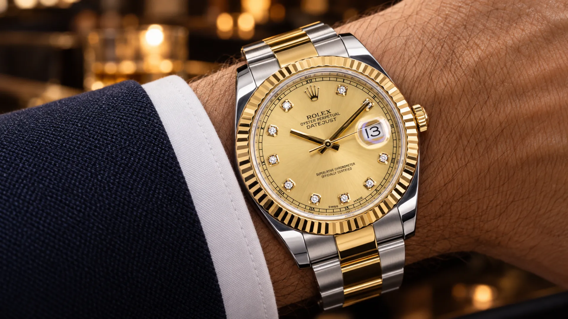 Gem-set dial Rolex Datejust 41 126333 with champagne diamond-marker dial worn at a navy suit cuff