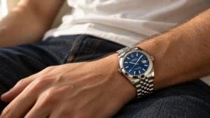 Steel Rolex Datejust on a Jubilee bracelet styled with a casual tee and dark denim outfit
