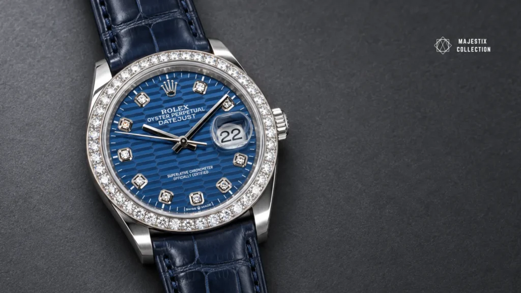 White gold diamond bezel watch with a blue dial on a navy alligator strap with a steel buckle