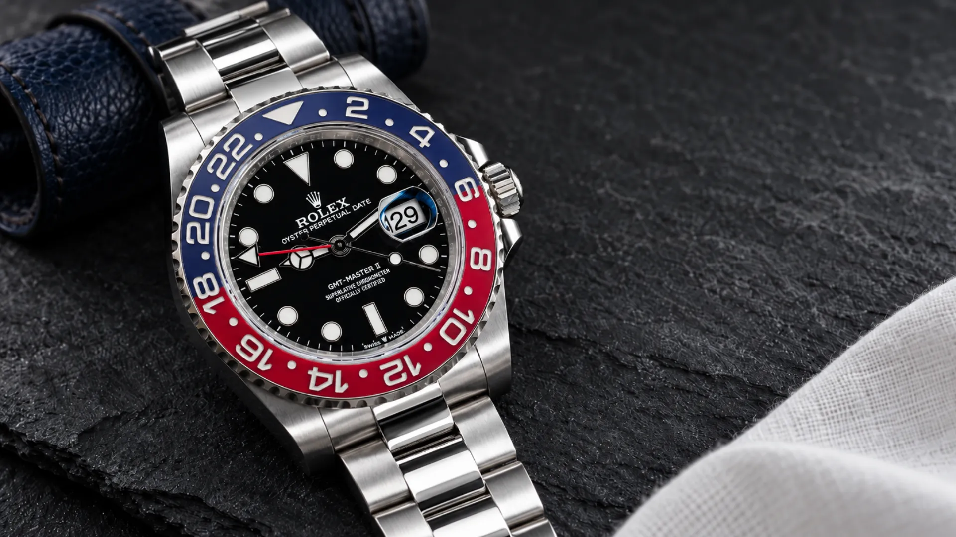 Styling a red and blue Pepsi bezel: Rolex GMT-Master II 126710BLRO on charcoal slate with navy leather